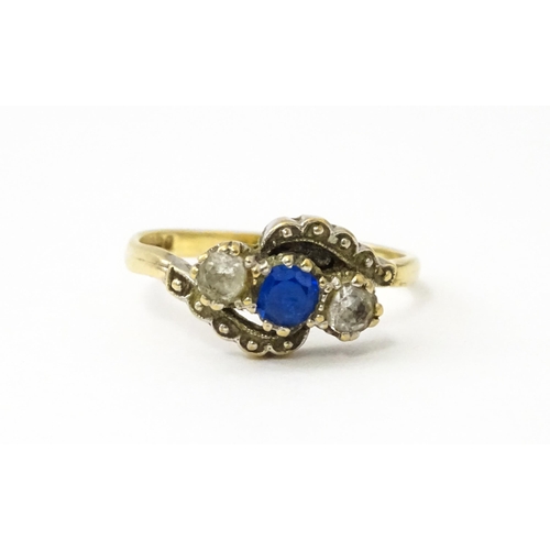 537 - A 9ct gold ring set with blue and white stones. Ring size approx. M 1/2