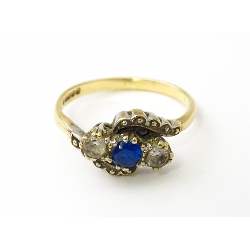 537 - A 9ct gold ring set with blue and white stones. Ring size approx. M 1/2