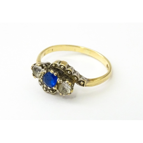 537 - A 9ct gold ring set with blue and white stones. Ring size approx. M 1/2