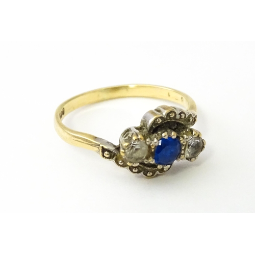 537 - A 9ct gold ring set with blue and white stones. Ring size approx. M 1/2