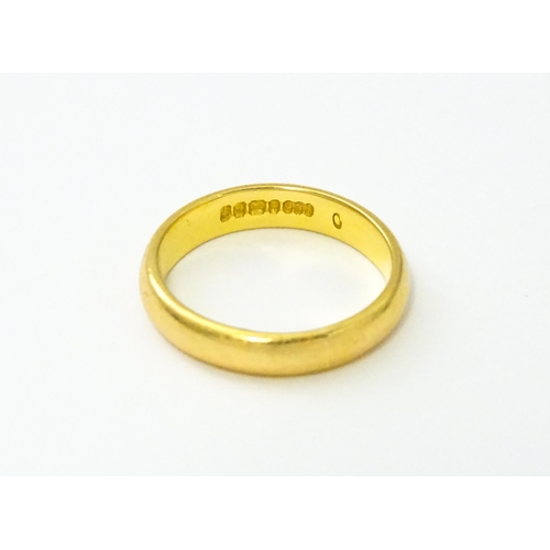 538 - A 22ct gold wedding band Ring size approx. I 1/2 (approx. 4g)