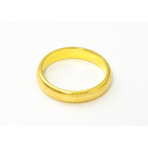 538 - A 22ct gold wedding band Ring size approx. I 1/2 (approx. 4g)