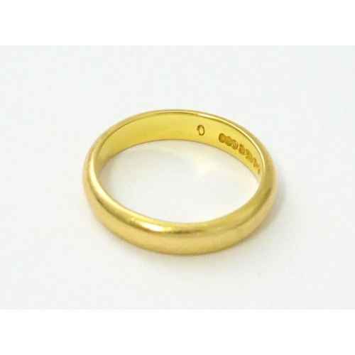 538 - A 22ct gold wedding band Ring size approx. I 1/2 (approx. 4g)