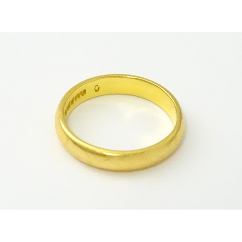 538 - A 22ct gold wedding band Ring size approx. I 1/2 (approx. 4g)