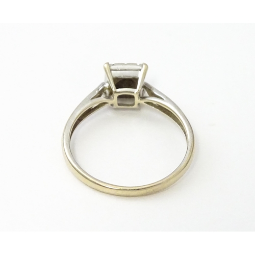 543 - A 9ct white gold ring set with nine diamonds in a square setting. Ring size approx. M 1/2