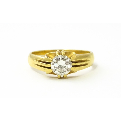 545 - A gold ring set with central diamond Ring size approx. S/ ( diamond approx 4mm) (total weight approx... 