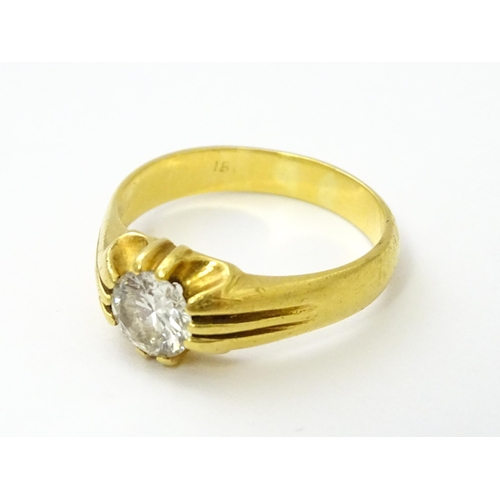 545 - A gold ring set with central diamond Ring size approx. S/ ( diamond approx 4mm) (total weight approx... 