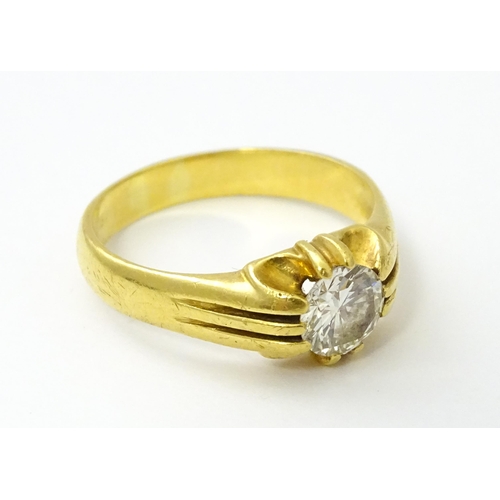 545 - A gold ring set with central diamond Ring size approx. S/ ( diamond approx 4mm) (total weight approx... 