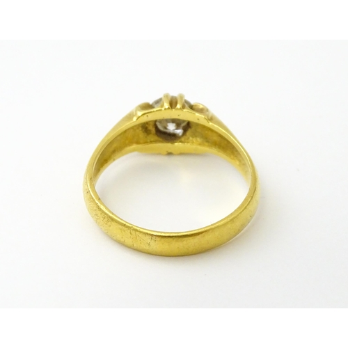 545 - A gold ring set with central diamond Ring size approx. S/ ( diamond approx 4mm) (total weight approx... 