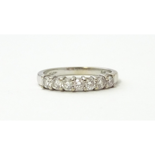 550 - An 18ct white gold half eternity ring set with 7 diamonds. Ring size approx. G