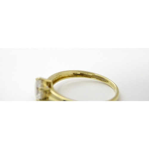 563 - Three 14ct gold rings set with white stones to be worn together. Ring size approx. R 1/2 (3)