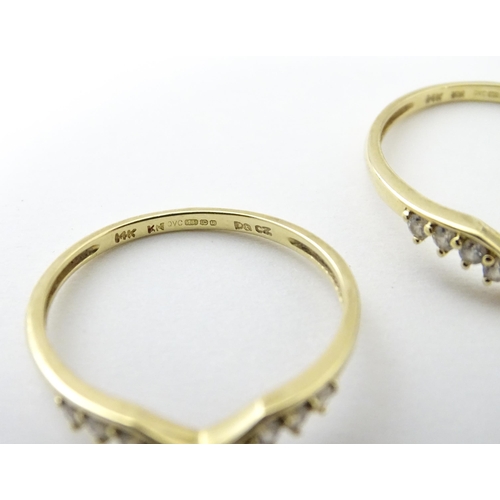 563 - Three 14ct gold rings set with white stones to be worn together. Ring size approx. R 1/2 (3)