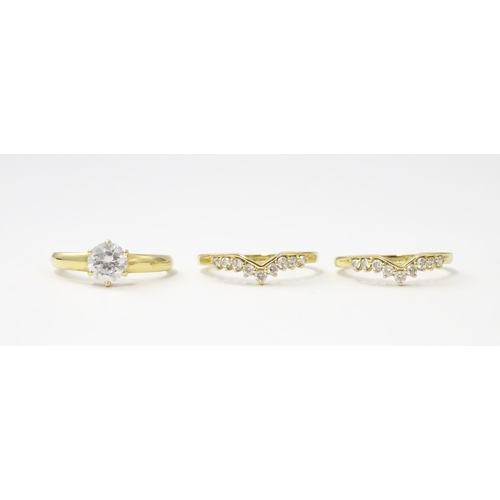 563 - Three 14ct gold rings set with white stones to be worn together. Ring size approx. R 1/2 (3)