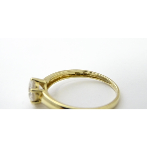 563 - Three 14ct gold rings set with white stones to be worn together. Ring size approx. R 1/2 (3)