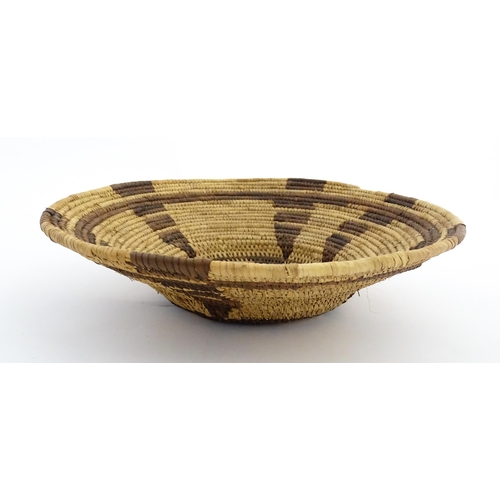 1102 - Ethnographic / Native / Tribal: A woven basket bowl with geometric banded detail, possibly Native Am... 