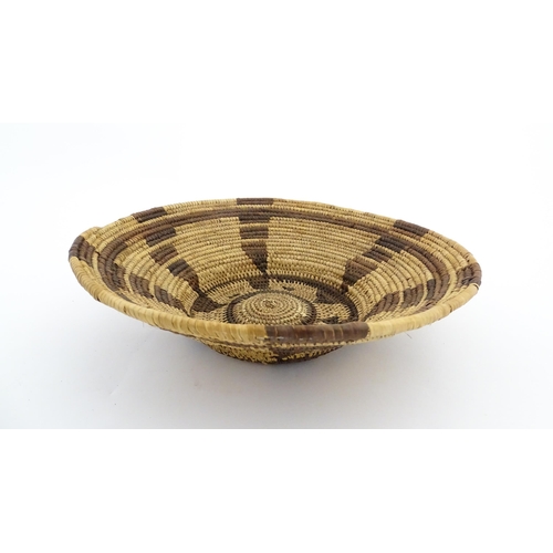 1102 - Ethnographic / Native / Tribal: A woven basket bowl with geometric banded detail, possibly Native Am... 