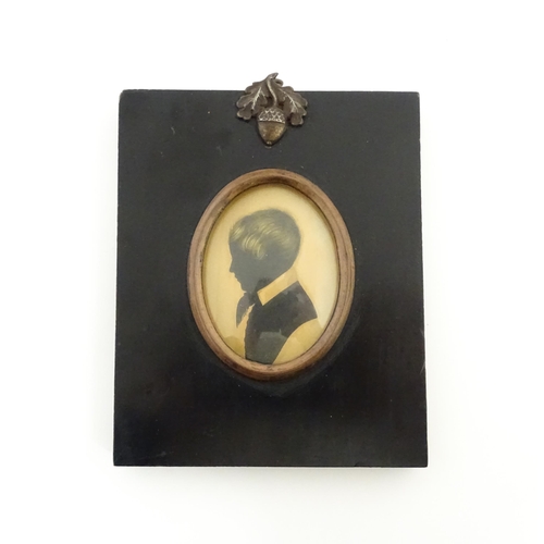 1237 - A 19thC silhouette portrait miniature depicting a young boy in profile, with gilt highlights. Approx... 