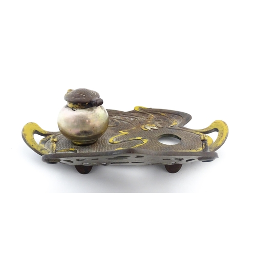 1266 - An Art Nouveau / Jugendstil cast standish of shaped form with enamel waterlily and lotus flower deta... 