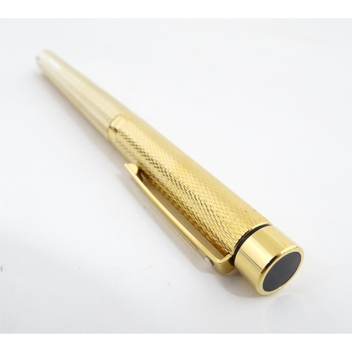 1272 - A cased Sheaffer 'Targa 1009' fountain pen with gold plated chequered barrel and cap, 14ct gold nib,... 