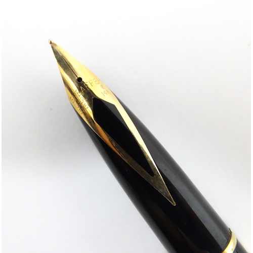 1272 - A cased Sheaffer 'Targa 1009' fountain pen with gold plated chequered barrel and cap, 14ct gold nib,... 