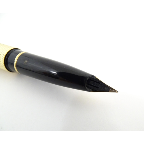 1272 - A cased Sheaffer 'Targa 1009' fountain pen with gold plated chequered barrel and cap, 14ct gold nib,... 