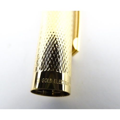 1272 - A cased Sheaffer 'Targa 1009' fountain pen with gold plated chequered barrel and cap, 14ct gold nib,... 