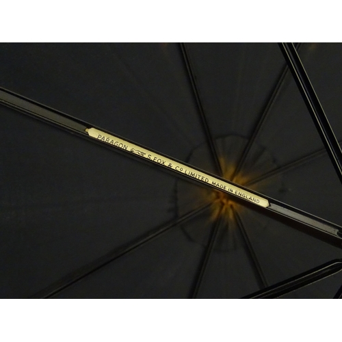 1297 - An early 20thC Paragon S. Fox & Co parasol / umbrella with ebonised handle, bearing label to spoke. ... 