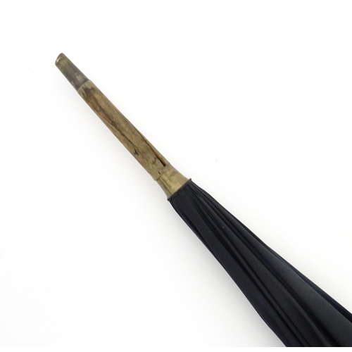 1297 - An early 20thC Paragon S. Fox & Co parasol / umbrella with ebonised handle, bearing label to spoke. ... 