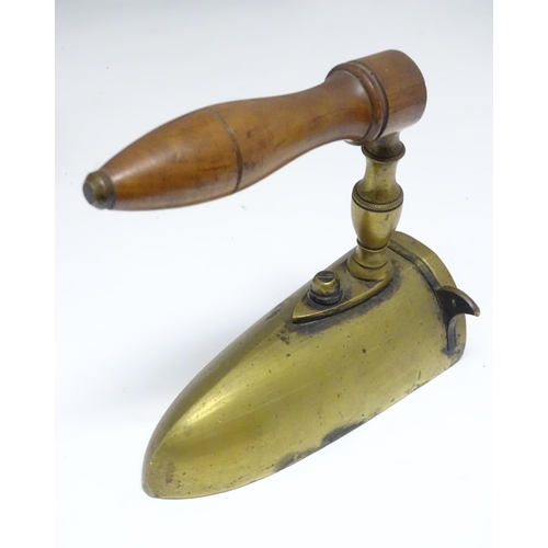 1306 - A quantity of assorted 19thC and later cast brass and iron flat irons, to include Feldmeyer spirit i... 