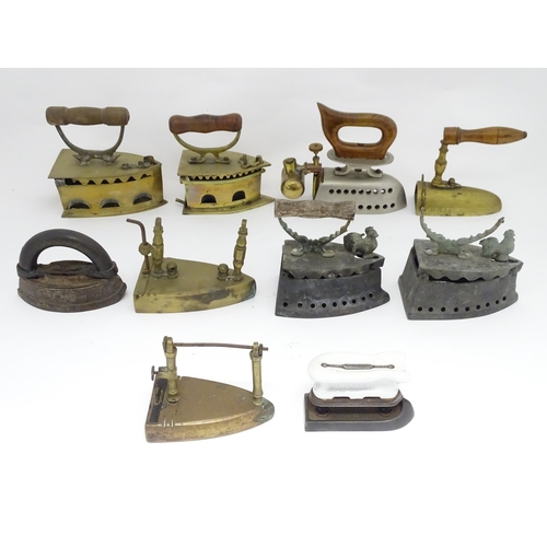 1306 - A quantity of assorted 19thC and later cast brass and iron flat irons, to include Feldmeyer spirit i... 