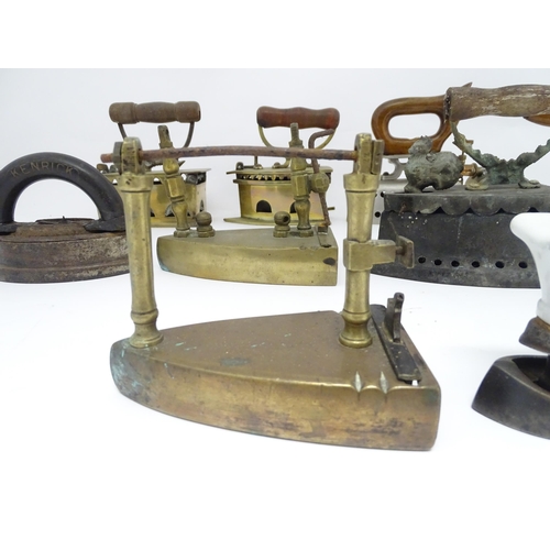 1306 - A quantity of assorted 19thC and later cast brass and iron flat irons, to include Feldmeyer spirit i... 