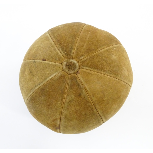 1324 - A 20thC suede medicine training ball. Approx. 11