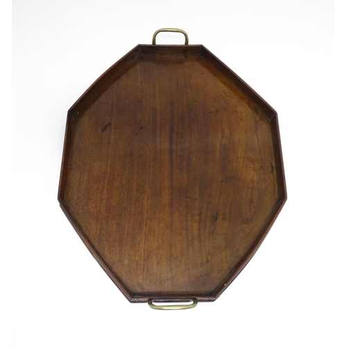 1352 - A late 19th / early 20thC mahogany tray of octagonal form with twin handles. Approx. 21 1/4