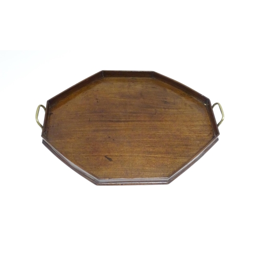 1352 - A late 19th / early 20thC mahogany tray of octagonal form with twin handles. Approx. 21 1/4