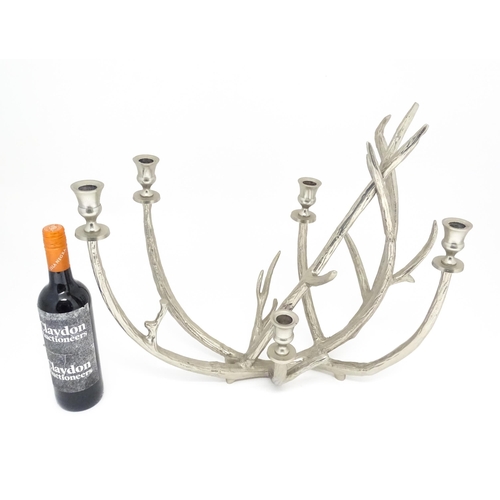 1353 - A 20thC cast candelabra / candle stand of antler form with five sconces. Approx. 18