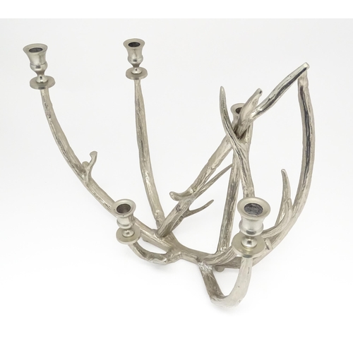 1353 - A 20thC cast candelabra / candle stand of antler form with five sconces. Approx. 18