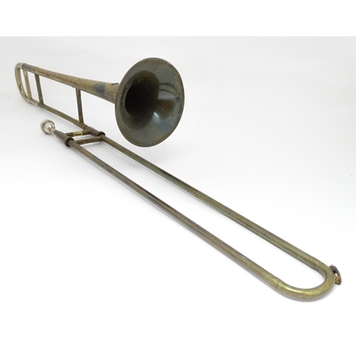 1369 - Musical Instrument : a mid 20thC 'Starline' Trombone by Rudall Carte & Co Ltd, London. Approx 46 1/2... 