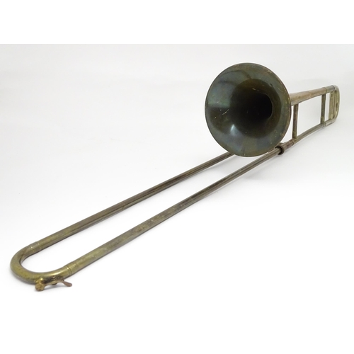 1369 - Musical Instrument : a mid 20thC 'Starline' Trombone by Rudall Carte & Co Ltd, London. Approx 46 1/2... 