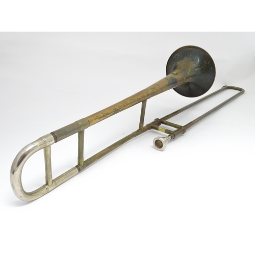 1369 - Musical Instrument : a mid 20thC 'Starline' Trombone by Rudall Carte & Co Ltd, London. Approx 46 1/2... 