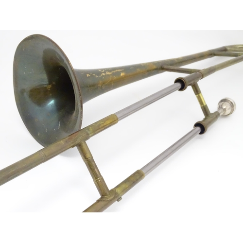 1369 - Musical Instrument : a mid 20thC 'Starline' Trombone by Rudall Carte & Co Ltd, London. Approx 46 1/2... 