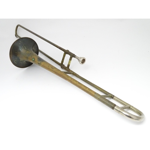 1369 - Musical Instrument : a mid 20thC 'Starline' Trombone by Rudall Carte & Co Ltd, London. Approx 46 1/2... 