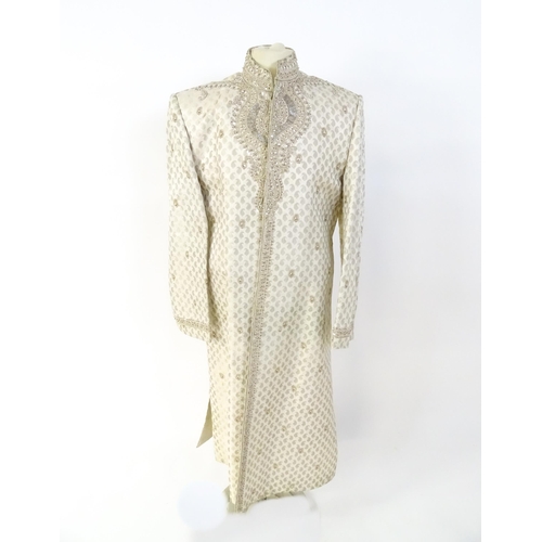 1388 - Vintage fashion / clothing: A cream coloured brocade Indian Shirwani / tunic with embroidery and bea... 