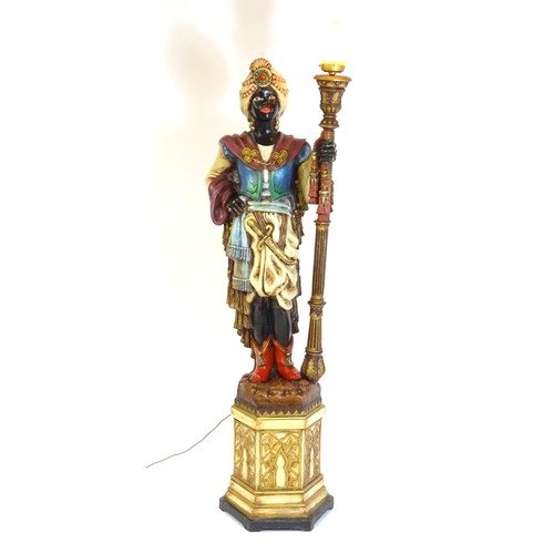 1552 - A mid 20thC blackamoor lamp, the lamp having a polychrome figural top grasping a torchiere, the figu... 