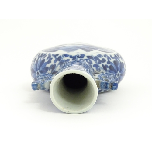 1 - A Chinese blue and white moon flask vase with twin foliate handles, decorated with central vignettes... 