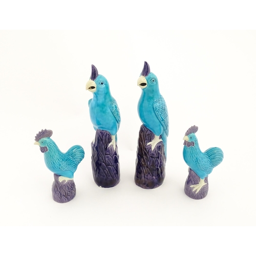 101 - A pair of Chinese models of parrots with turquoise and purple glaze. Together with a pair of similar... 