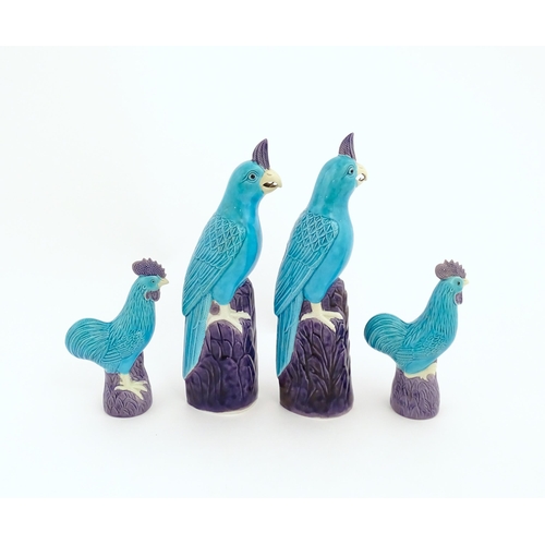 101 - A pair of Chinese models of parrots with turquoise and purple glaze. Together with a pair of similar... 