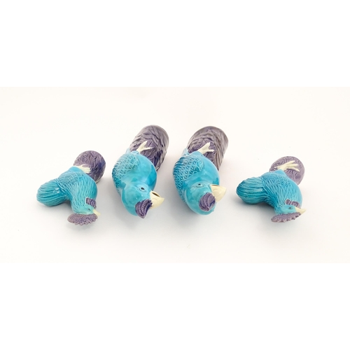 101 - A pair of Chinese models of parrots with turquoise and purple glaze. Together with a pair of similar... 