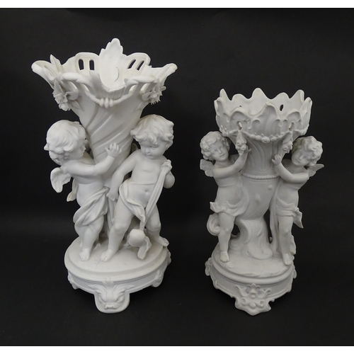 108 - Two bisque vases of cornucopia form with cherub / putti and swag detail. Largest approx. 10