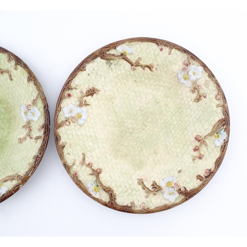 114 - Two Victorian majolica Holdcroft plates of circular form decorated with cherry blossom flowers. Appr... 