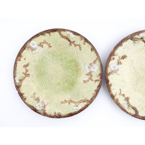 114 - Two Victorian majolica Holdcroft plates of circular form decorated with cherry blossom flowers. Appr... 